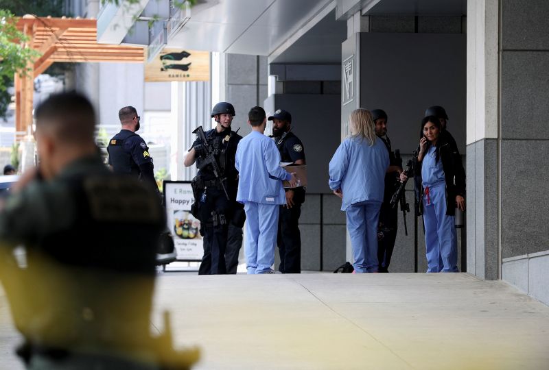 More hospitals turn to police forces to keep health care workers safe, but there are downsides to that | CNN