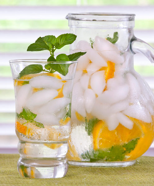 Mint flavors drinks from mojito to iced tea. Orange mint leaves and slices of oranges add fresh flavor to this pitcher of water.