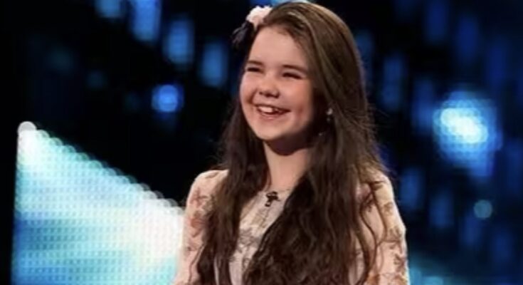 Even Simon Cowell was stunned! You won’t believe the profound voice coming out of this 12-year-old girl and her oversized guitar. Watch the full video in the comments.
