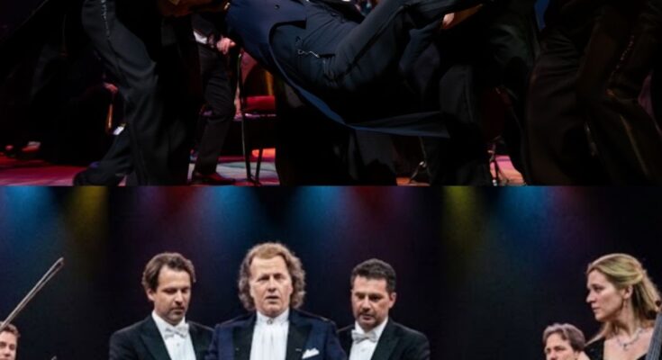 🎻 The Moment André Rieu Almost Fell on Stage Left the Audience Holding Their Breath… During a performance, André Rieu suddenly felt dizzy due to a vestibular disorder. As he began to lose his balance on stage, the orchestra that has stood by him for over