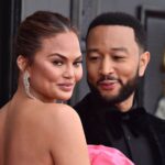 At the 2025 Grammys, Chrissy Teigen draws attention in an almost bare mesh gown alongside John Legend.