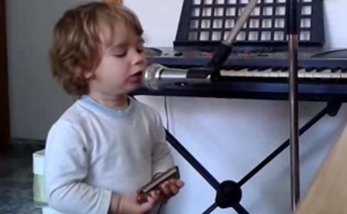 Two-year-old baby creates adorable moment with harmonica